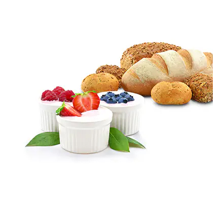 Απεικονίζονται διάφορα είδη ψωμιών και γιαουρτιού.